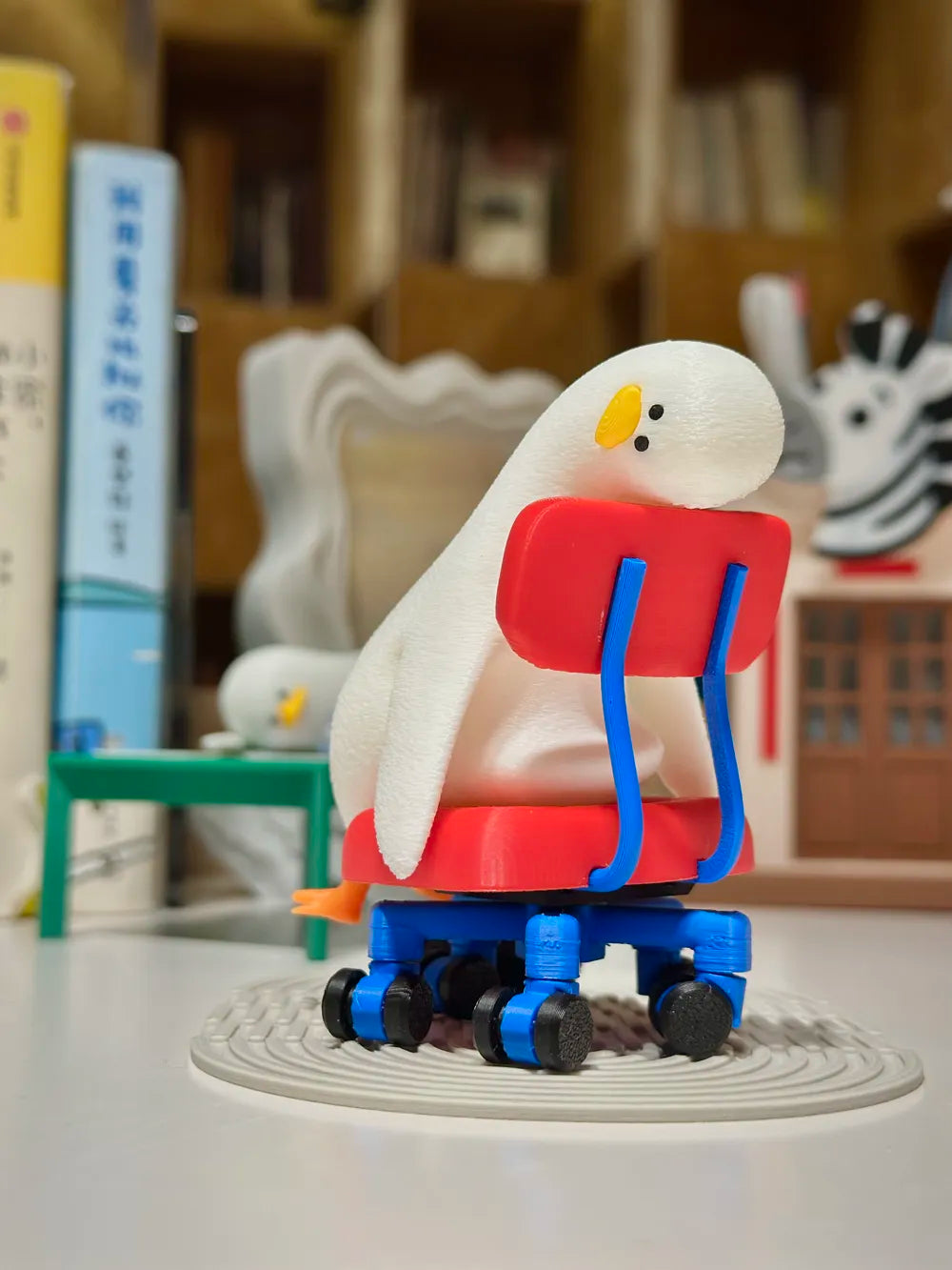 Lying Flat Duck in Rotatable Chair – 3D Printed Lazy Duck Figurine